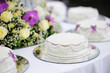 Delicious white and purple decorated wedding cake