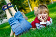 Mischievous little pigeon pair on a green grass