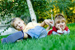 Mischievous little pigeon pair on a green grass