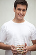 Photo: Man holding wine bottle corks Man holding wine bottle corks