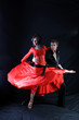 Photo: dancers in action against black background dancers in action against black background