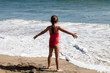 Little Girl Waiting for the Ocean Wave
