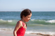 Little Girl Walking and Talking by the Ocean