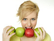 Foto: Beautiful young woman bites into an apple Beautiful young woman bites into an apple
