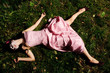 girl lie on the grass like a corpse