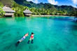 Young couple snorkeling in clean water over coral Young couple snorkeling in clean water over coral