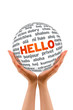 Hands holding a Hello 3D Sphere