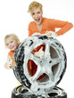 Young woman and cute girl cleaning a wheel
