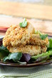 fried chicken in sesame seeds with salad