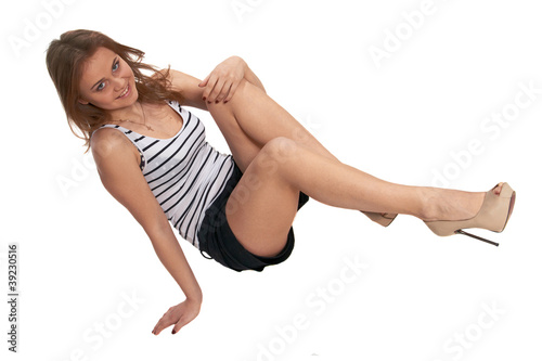 Photo: A young woman in shorts A young woman in shorts