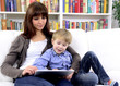 mother and son playing with digital touchpad