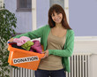 Charity: Woman with clothing donation box