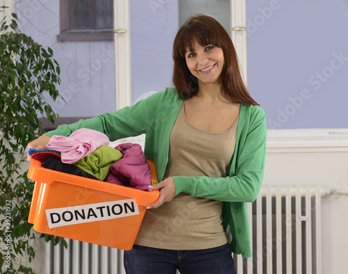 Photo: Charity: Woman with clothing donation box Charity: Woman with clothing donation box