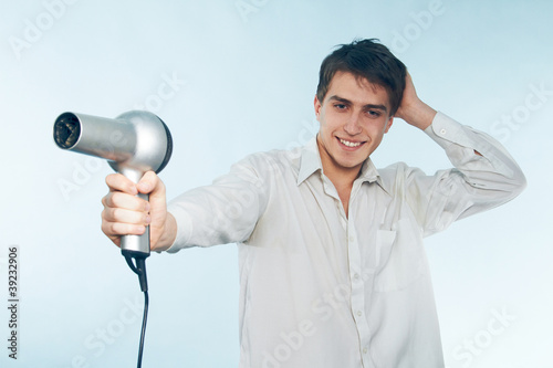 Photo: man with a hair dryer man with a hair dryer
