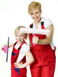 Sisters in overalls ready to clean windows for spring cleaning