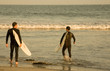 Two surfers on a warm summer day at the beach. Two surfers on a warm summer day at the beach.