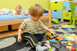 Two little boys playing in their room
