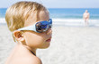 little boy with sunshades on a beach in summer time little boy with sunshades on a beach in summer time