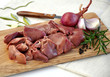 Raw liver on wooden board