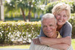Portrait of a woman hugging a man from behind