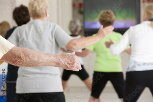 Photo: Seniors exercising in a health club Seniors exercising in a health club
