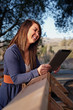 Asian girl reading on a tablet Asian girl reading on a tablet