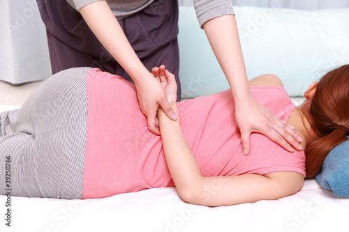 Photo: woman getting chiropractic woman getting chiropractic