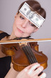 woman plays the viola with banknotes on forehead woman plays the viola with banknotes on forehead