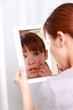 young woman worries about dry rough skin