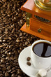 cup of coffee and grinder
