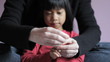 Mother Trimming Little Girls Fingernails
