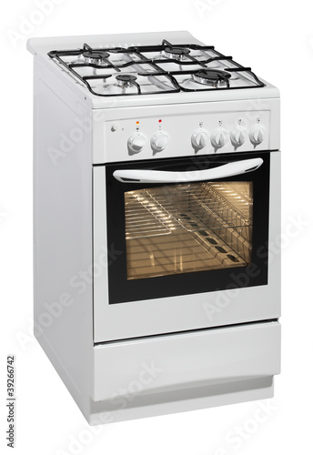 Photo: White free standing cooker isolated over white White free standing cooker isolated over white