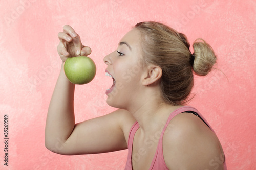 Photo: A pretty girl with an apple A pretty girl with an apple