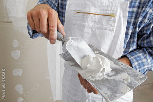 Photo: studwork: filling the joints of the plaster boards studwork: filling the joints of the plaster boards
