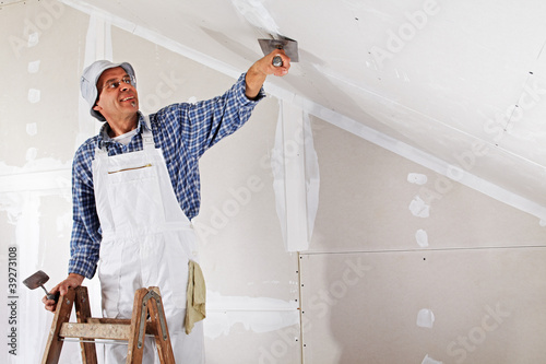 Photo: studwork: filling the joints of the plaster boards studwork: filling the joints of the plaster boards
