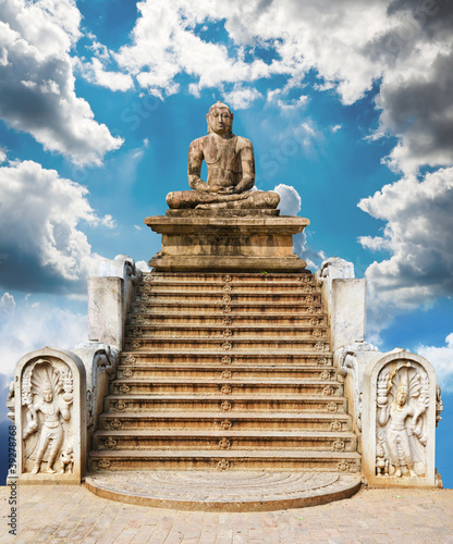 Photo: statue of a meditating Buddha against the sky. A collage of many statue of a meditating Buddha against the sky. A collage of many