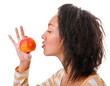 Portrait of  girl with a ripe apple on a white background