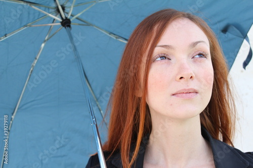 Foto: Pretty woman with an umbrella Pretty woman with an umbrella