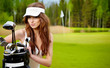 Portrait of an elegant woman playing golf on a green