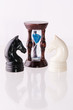 Two chess horses with sand-clock