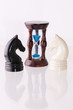 Two chess horses with sand-clock