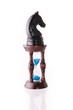 Black chess horse with sand-clock