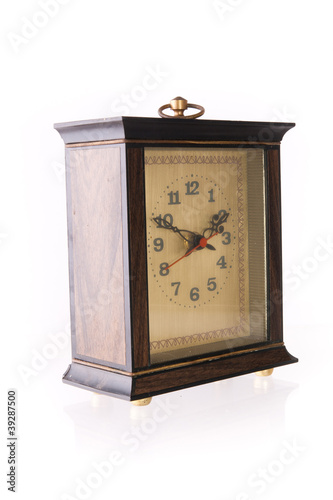 Photo: Old-fashion table clock made of wood Old-fashion table clock made of wood