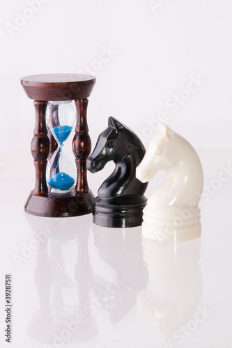 Photo: Two chess horses with sand-clock Two chess horses with sand-clock