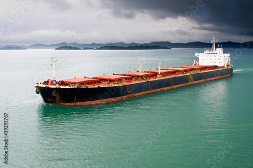 Photo: Bulk transport carrier under stormy sky Bulk transport carrier under stormy sky