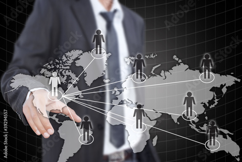 Photo: businessman pushing people social network. businessman pushing people social network.