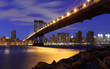 New York City Skyline and Manhattan Bridge At Night..