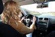 Woman driving car on a country road