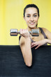 portrait of  young woman lifting free weights
