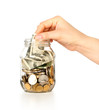 Glass bank for tips with money and hand